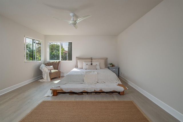 unfurnished bedroom featuring light wood-type flooring and ceiling fan