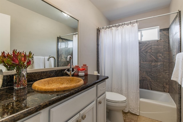 full bathroom featuring vanity, toilet, tile patterned floors, and shower / bath combo with shower curtain