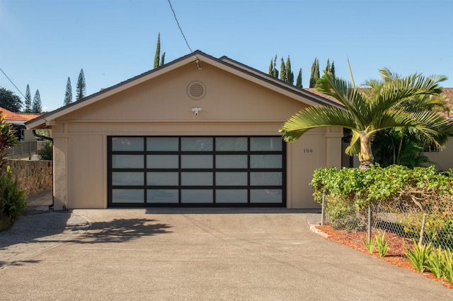 view of front of home featuring a garage and an outdoor structure