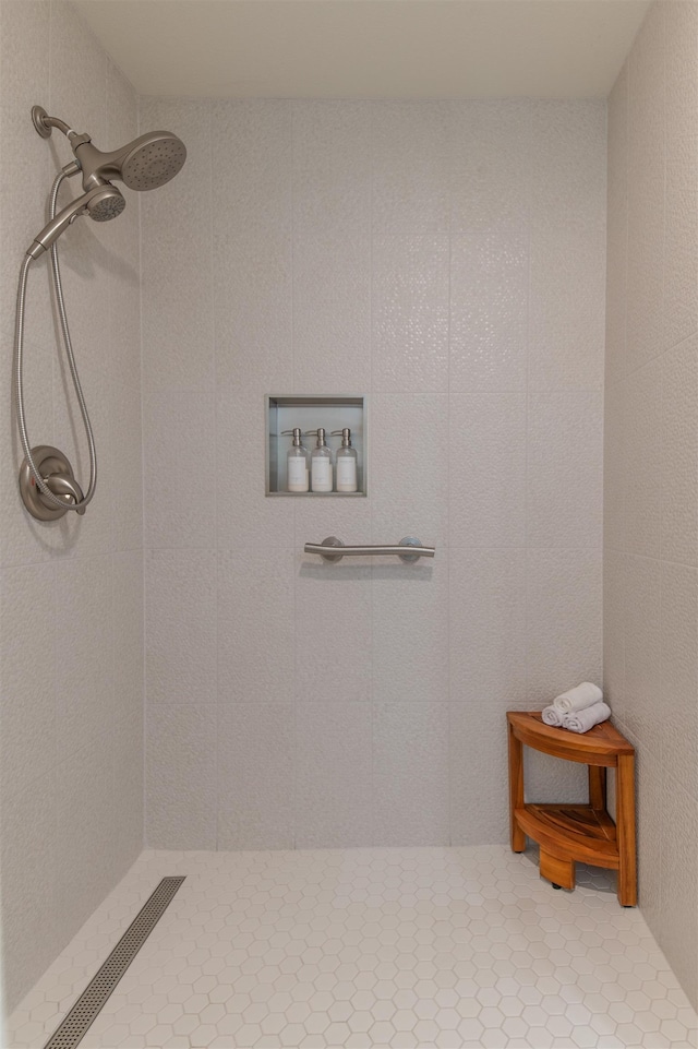 bathroom with tiled shower