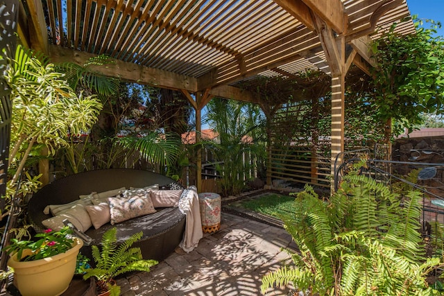 view of patio featuring outdoor lounge area and a pergola