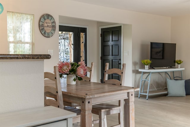 dining space featuring light hardwood / wood-style flooring