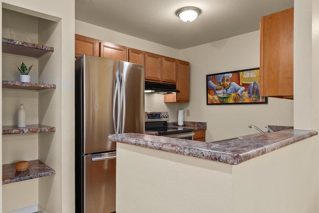480 Kenolio Rd Unit 21-101, Kihei, HI 96753 - kitchen featuring appliances with stainless steel finishes, under cabinet range hood, a peninsula, brown cabinetry, and open shelves