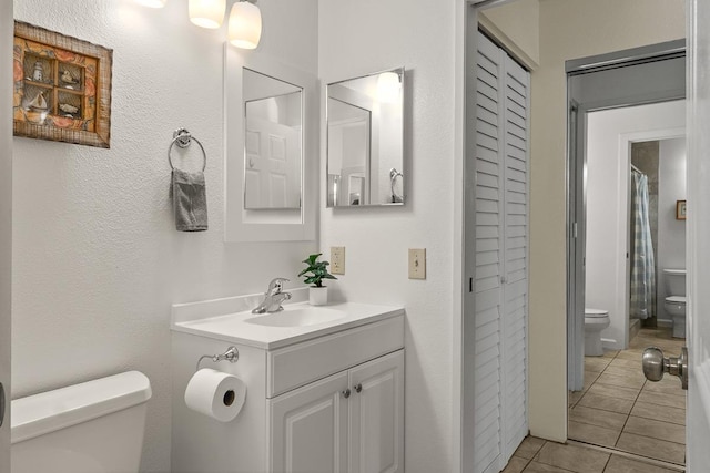 480 Kenolio Rd Unit 21-101, Kihei, HI 96753 - full bathroom with toilet, a closet, tile patterned floors, and vanity