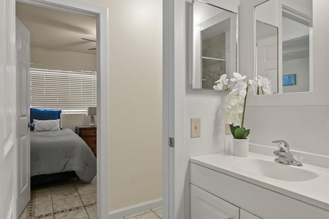 480 Kenolio Rd Unit 21-101, Kihei, HI 96753 - bathroom with tile patterned floors, vanity, ensuite bath, and baseboards