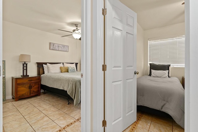 480 Kenolio Rd Unit 21-101, Kihei, HI 96753 - bedroom with light tile patterned flooring and a ceiling fan