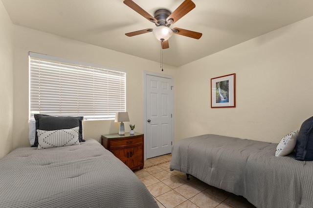 480 Kenolio Rd Unit 21-101, Kihei, HI 96753 - bedroom with light tile patterned flooring and a ceiling fan