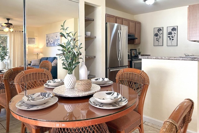 480 Kenolio Rd Unit 21-101, Kihei, HI 96753 - dining area featuring ceiling fan, baseboards, and light tile patterned flooring