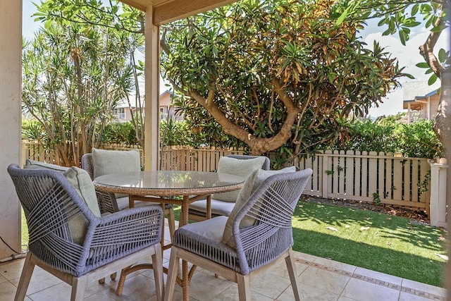 480 Kenolio Rd Unit 21-101, Kihei, HI 96753 - fenced backyard with outdoor dining space and a patio