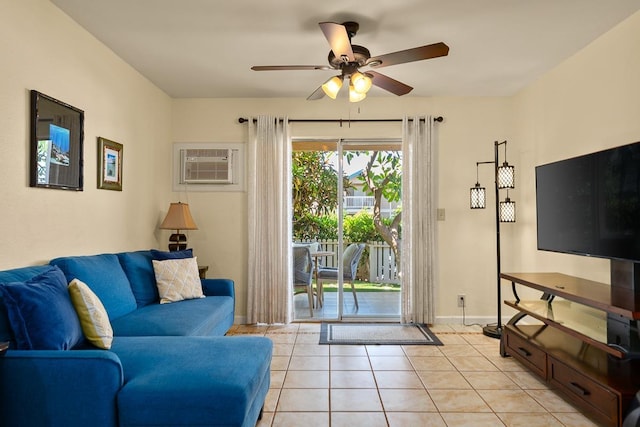 480 Kenolio Rd Unit 21-101, Kihei, HI 96753 - living room with a wall mounted AC, ceiling fan, light tile patterned floors, and baseboards