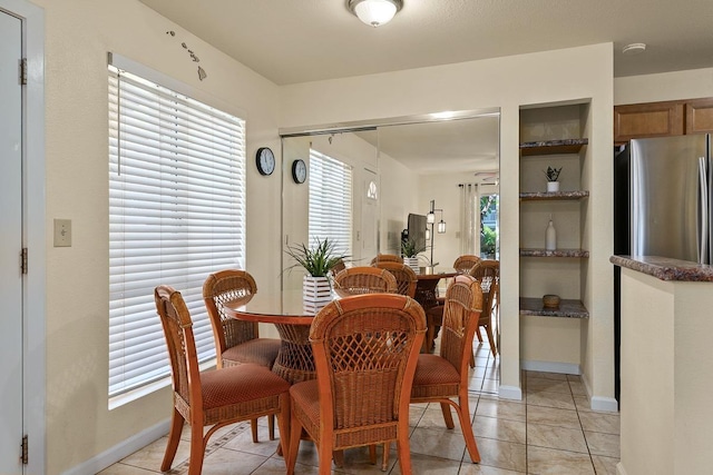 480 Kenolio Rd Unit 21-101, Kihei, HI 96753 - dining area featuring light tile patterned floors and baseboards