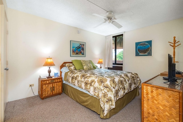 2695 S Kihei Rd Unit 1204, Kihei, HI 96753 - bedroom with carpet flooring, a textured ceiling, and ceiling fan