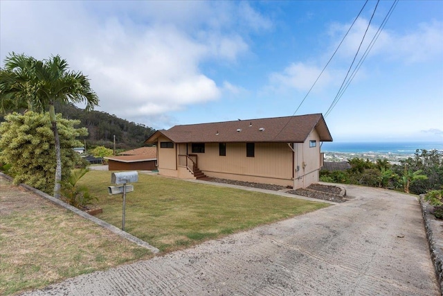 back of house featuring a yard