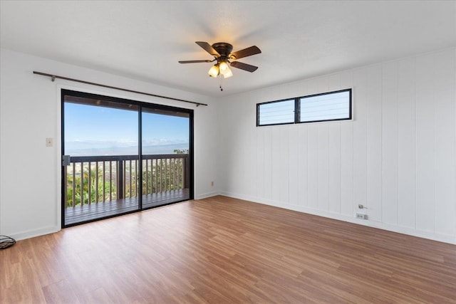 empty room featuring ceiling fan and wood-type flooring