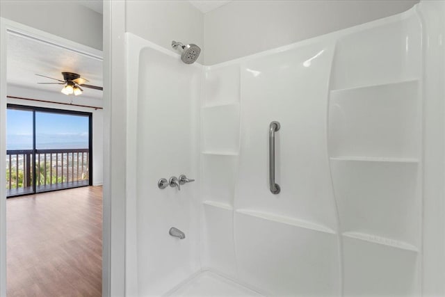 bathroom with walk in shower, wood-type flooring, and ceiling fan