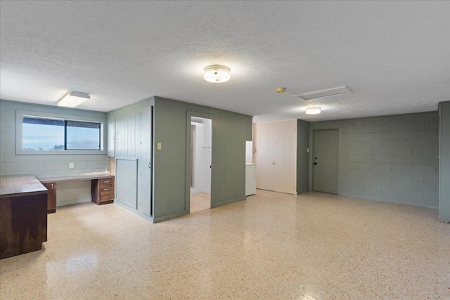 interior space with a textured ceiling