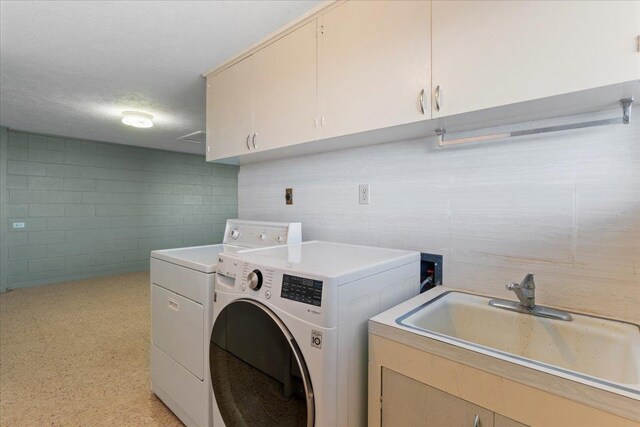263 S Alu Rd, Wailuku, HI 96793 - laundry room featuring cabinet space, a textured ceiling, washing machine and dryer, and concrete block wall