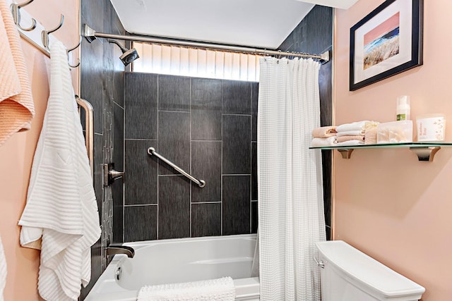 bathroom featuring shower / bath combination with curtain and toilet