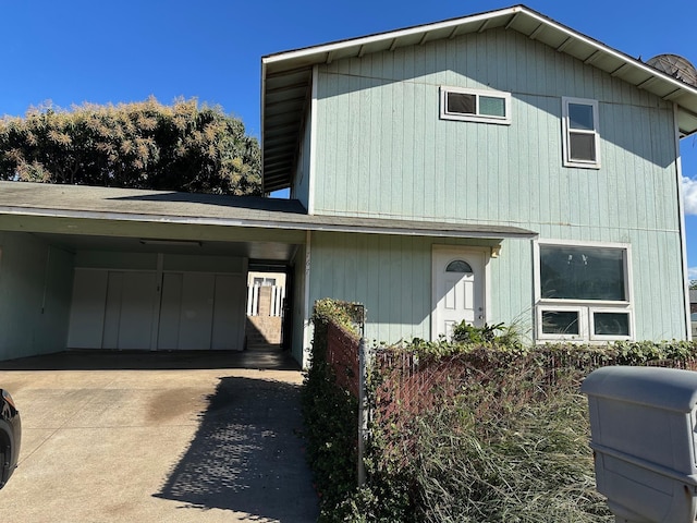 front facade with a carport