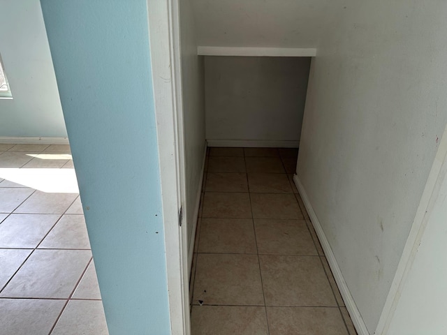 corridor featuring light tile patterned flooring