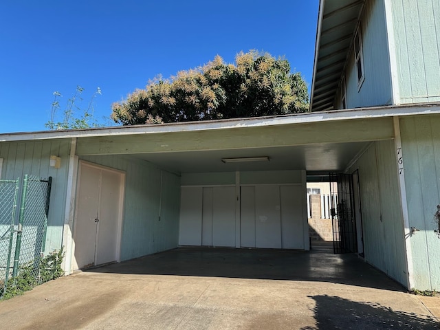 garage featuring a carport