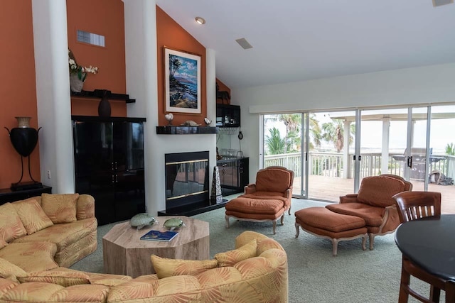 living room featuring high vaulted ceiling and carpet