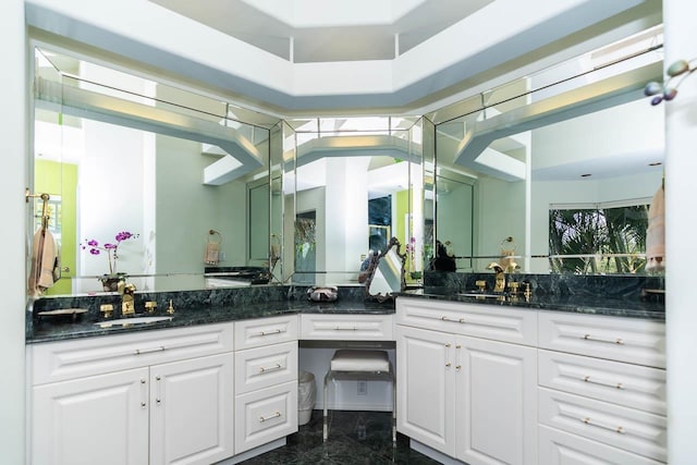 bathroom with double vanity and tile flooring