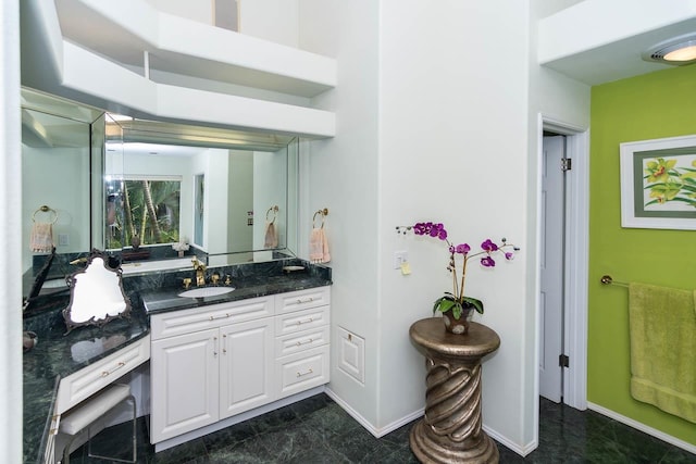 bathroom featuring tile flooring and vanity