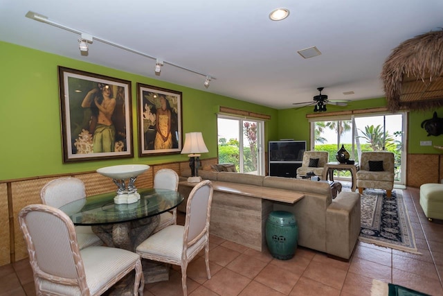 living room with ceiling fan, tile floors, and track lighting