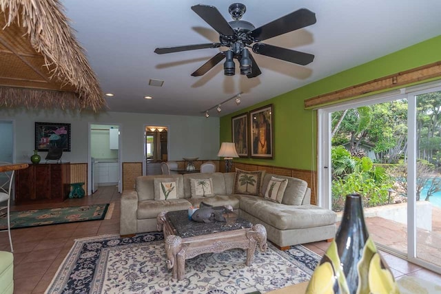 living room with rail lighting, tile floors, and ceiling fan