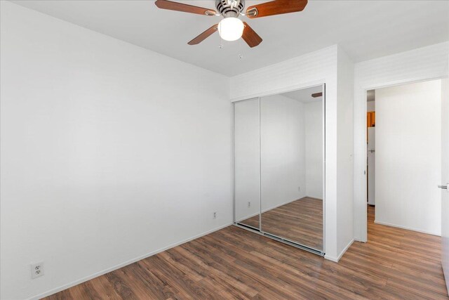 spare room featuring light hardwood / wood-style floors and ceiling fan