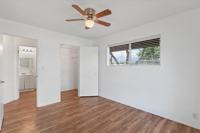 unfurnished room with wood-type flooring and ceiling fan