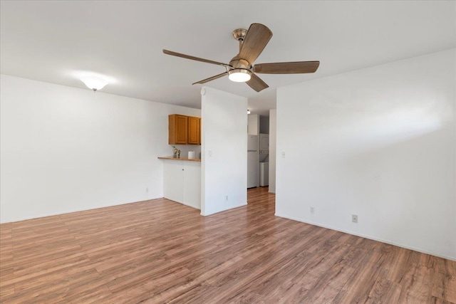 unfurnished living room with ceiling fan and light hardwood / wood-style floors