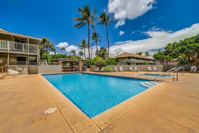 view of swimming pool with a patio