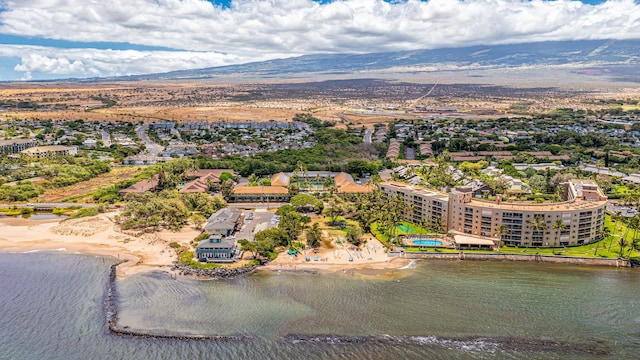 drone / aerial view featuring a water and mountain view