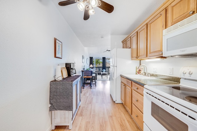 kitchen with light brown cabinets, white appliances, ceiling fan, and light hardwood / wood-style floors