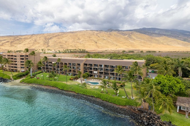 birds eye view of property with a mountain view