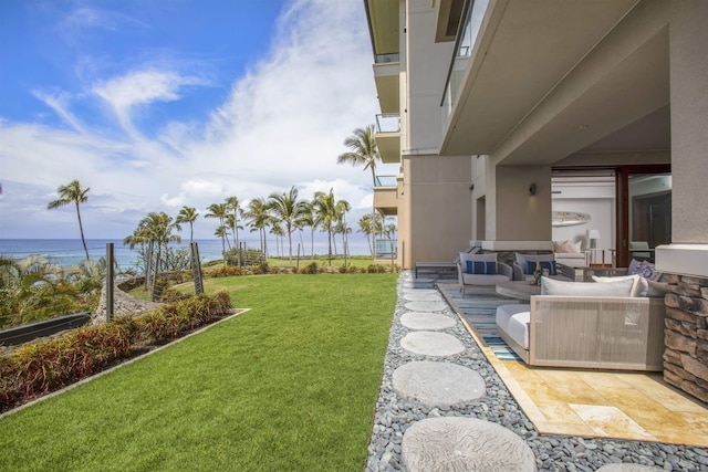 1 Bay Dr Unit 1205, Lahaina, HI 96761 - view of grassy yard featuring an outdoor living space, a water view, and a patio area