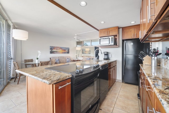 2450 S Kihei Rd Unit 506, Kihei, HI 96753 - kitchen with black appliances, a sink, a peninsula, light tile patterned floors, and recessed lighting