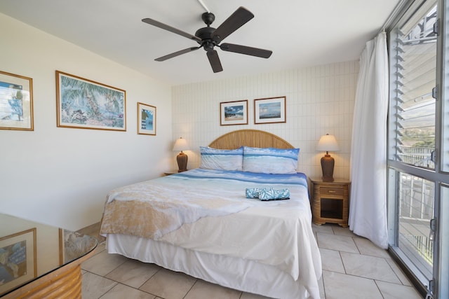 2450 S Kihei Rd Unit 506, Kihei, HI 96753 - bedroom featuring multiple windows, light tile patterned floors, ceiling fan, and tile walls