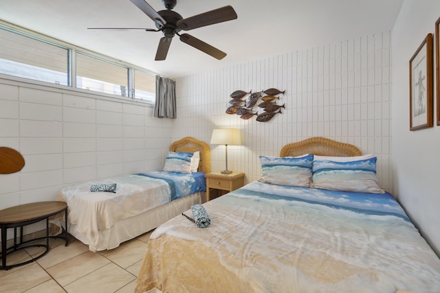 2450 S Kihei Rd Unit 506, Kihei, HI 96753 - bedroom with tile walls, light tile patterned floors, and a ceiling fan