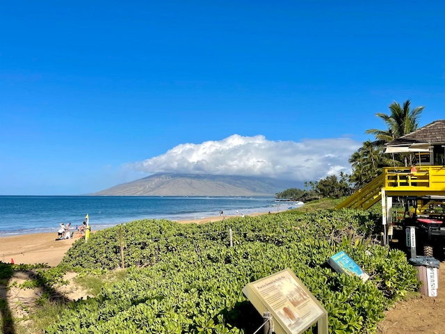 water view with a beach view and a mountain view