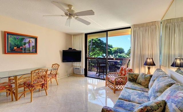 tiled living room with floor to ceiling windows, ceiling fan, and a textured ceiling