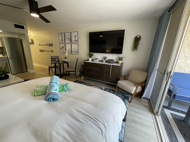 bedroom featuring light wood-type flooring, a ceiling fan, access to outside, and baseboards