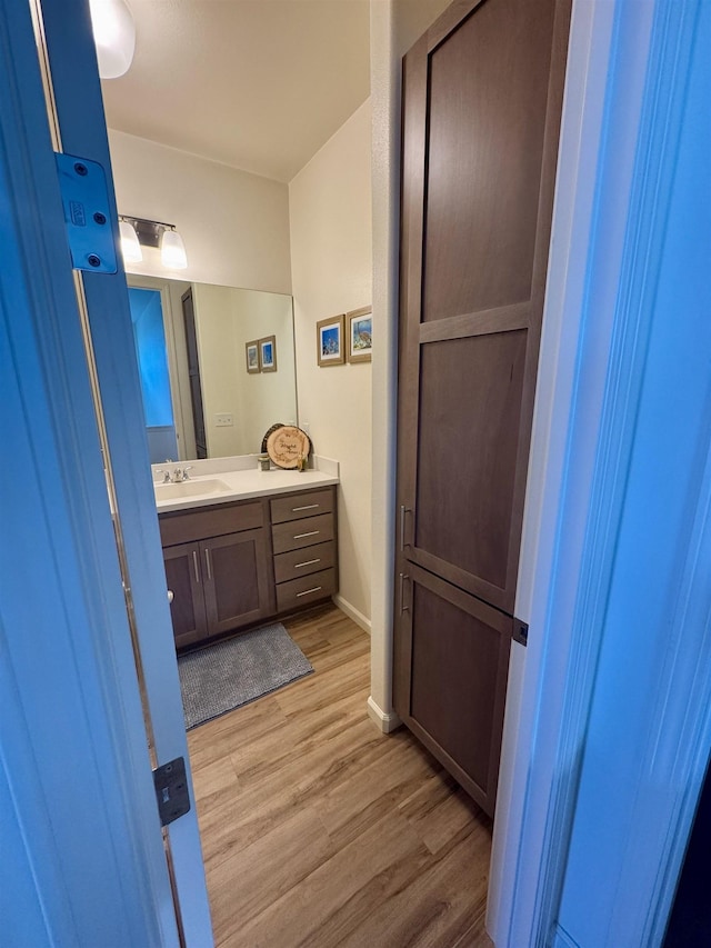 24 Kupaloke St, Wailuku, HI 96793 - bathroom featuring wood finished floors, vanity, and baseboards