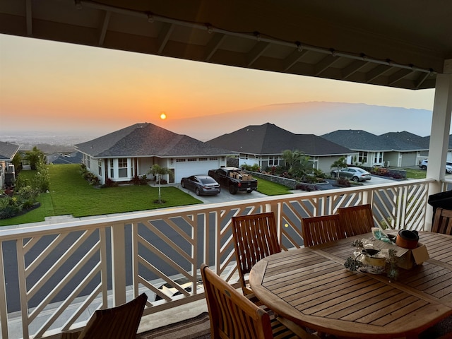24 Kupaloke St, Wailuku, HI 96793 - balcony at dusk featuring a residential view and outdoor dining area