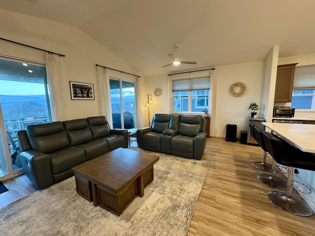 24 Kupaloke St, Wailuku, HI 96793 - living room with light wood-style floors, lofted ceiling, ceiling fan, and healthy amount of natural light