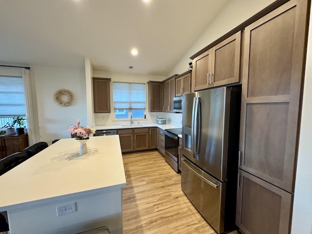 24 Kupaloke St, Wailuku, HI 96793 - kitchen with appliances with stainless steel finishes, a sink, plenty of natural light, light countertops, and vaulted ceiling