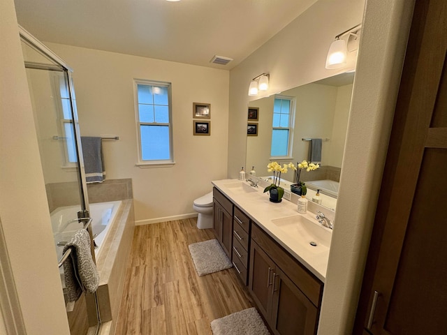 24 Kupaloke St, Wailuku, HI 96793 - full bath featuring double vanity, wood finished floors, a bath, toilet, and baseboards