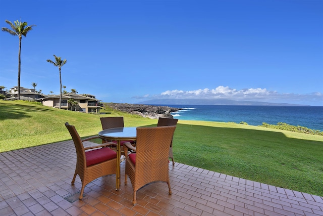 view of patio featuring a water view and a view of the beach